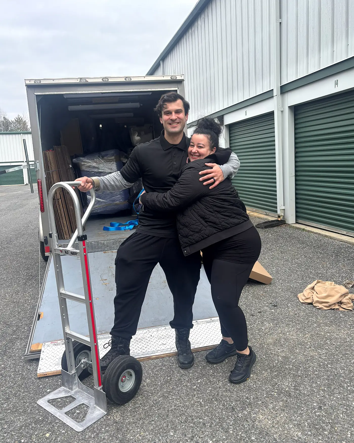 Brandi Bradshaw and co-owner Peyton Jones with the company box truck, ready for a local move